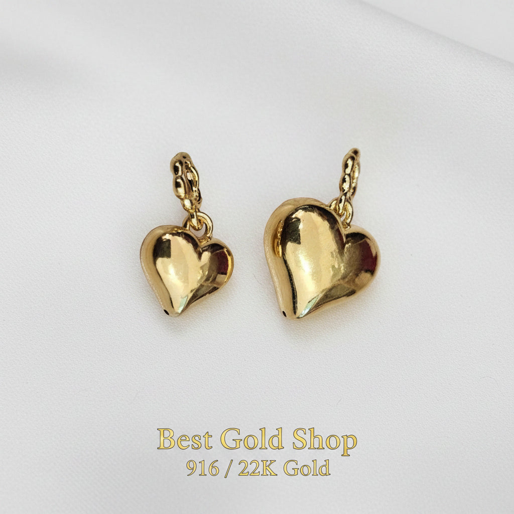 Guild Bullion 916 gold polished heart pair; collection design reference. Check selector for current options and availability.