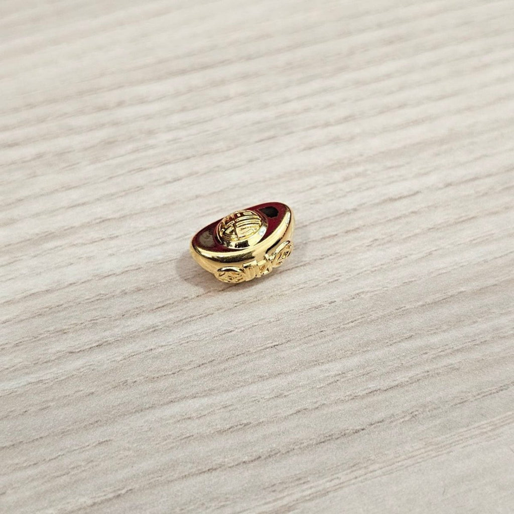 Guild Bullion 916 gold ingot shaped charm on wood; collection design reference. Check selector for current options and availability.