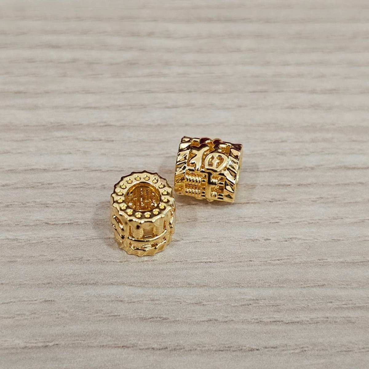 Guild Bullion 916 gold square and barrel bead pair; collection design reference. Check selector for current options and availability.