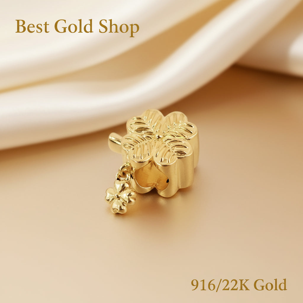 Guild Bullion 916 gold floral bead with dangle; collection design reference. Check selector for current options and availability.