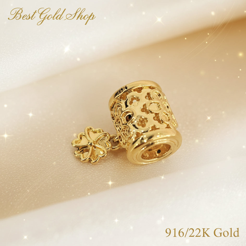 Guild Bullion 916 gold barrel bead with flower dangle; collection design reference. Check selector for current options and availability.