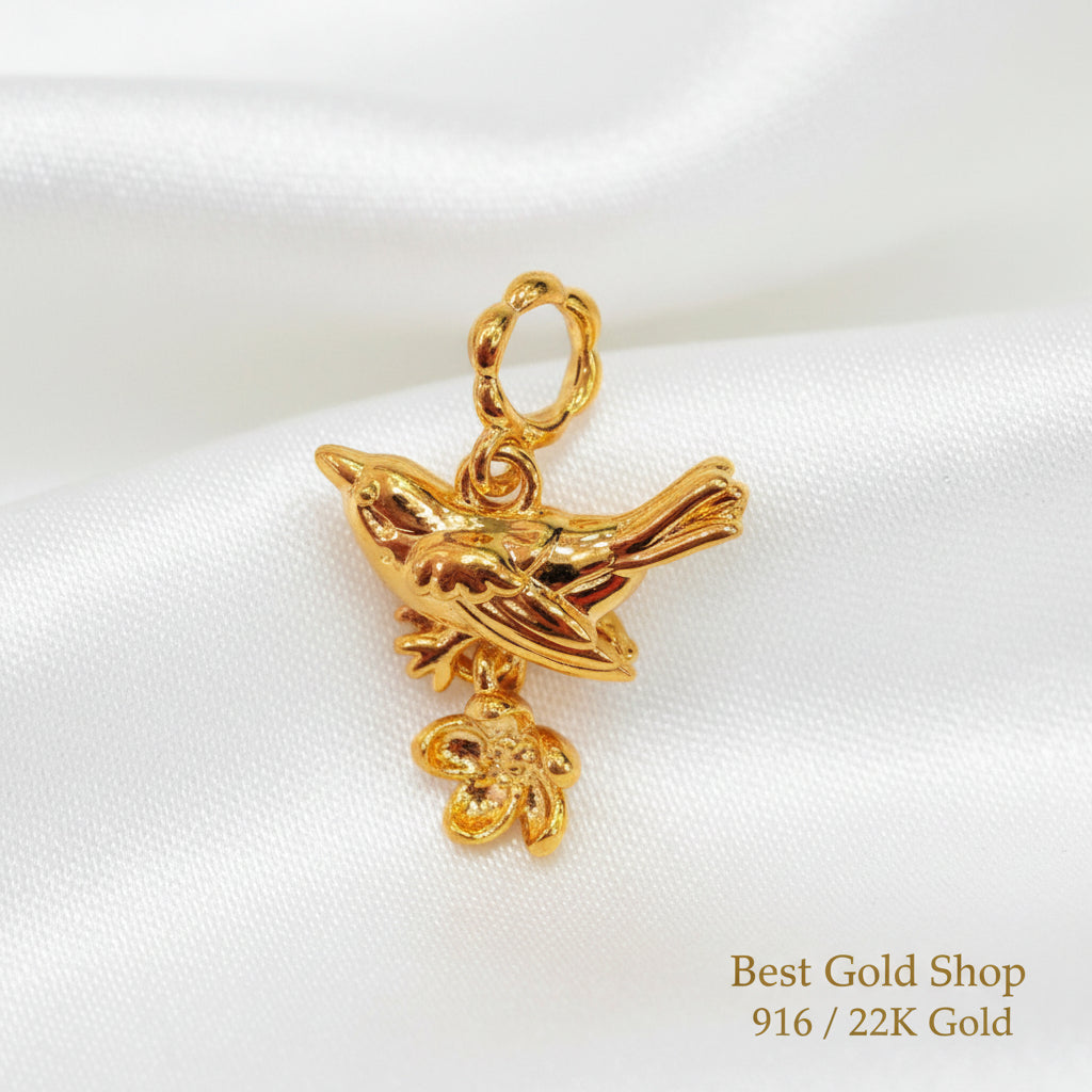 Guild Bullion 916 gold bird and coin charm; collection design reference. Check selector for current options and availability.