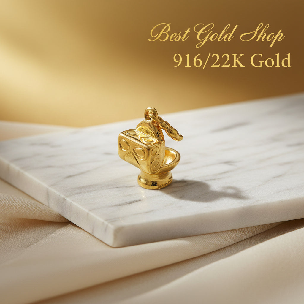 Guild Bullion 916 gold cube and disc charm; collection design reference. Check selector for current options and availability.