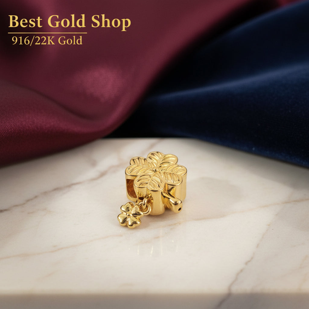 Guild Bullion 916 gold flower bead with dangle; collection design reference. Check selector for current options and availability.