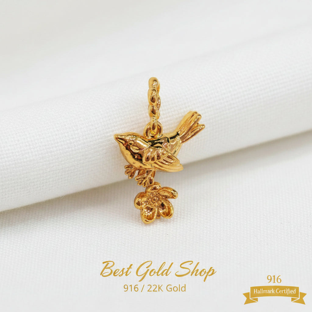 Guild Bullion 916 gold bird and coin charm; collection design reference. Check selector for current options and availability.