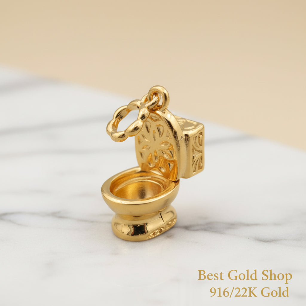 Guild Bullion 916 gold toilet novelty charm; collection design reference. Check selector for current options and availability.