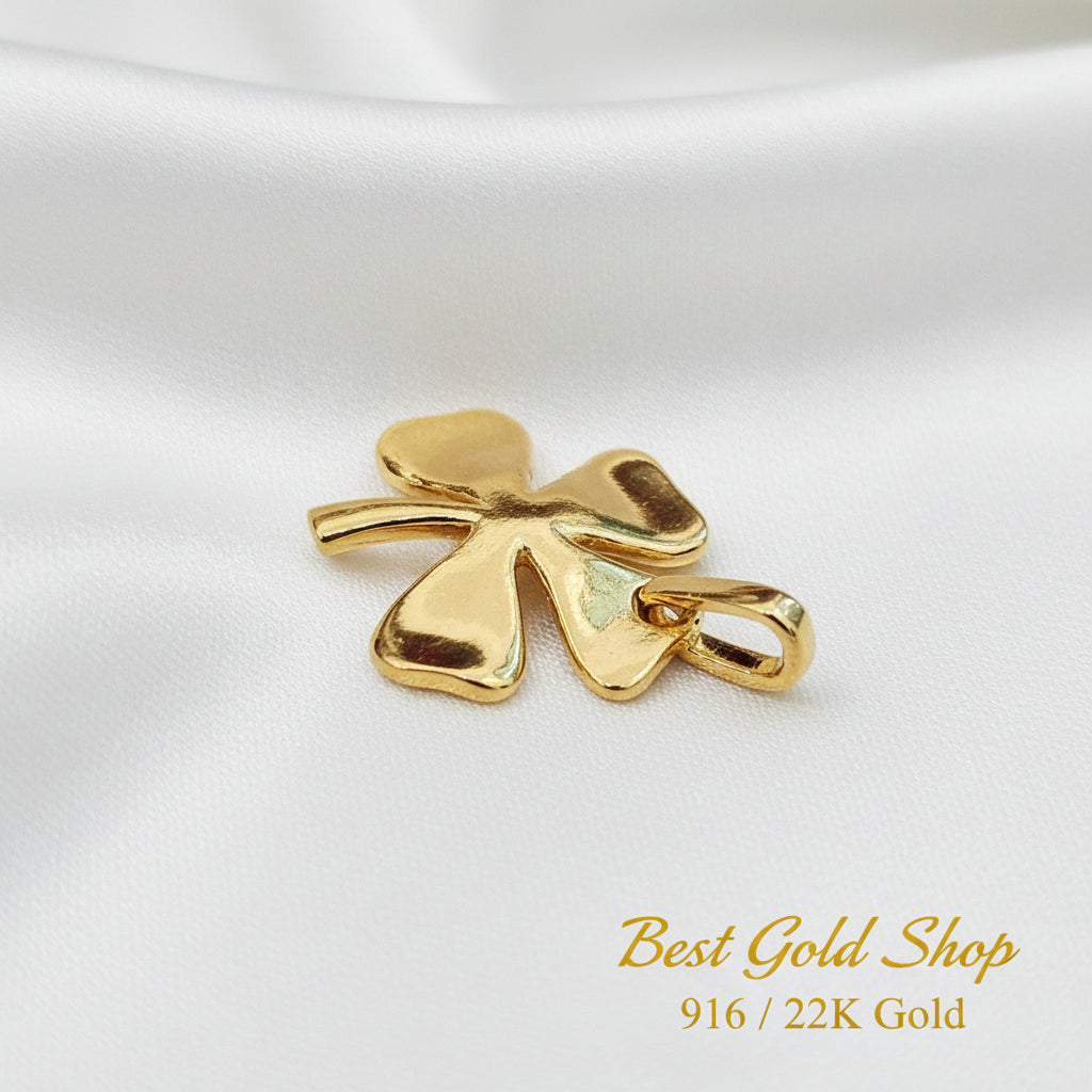 Guild Bullion 916 gold polished clover charm; collection design reference. Check selector for current options and availability.