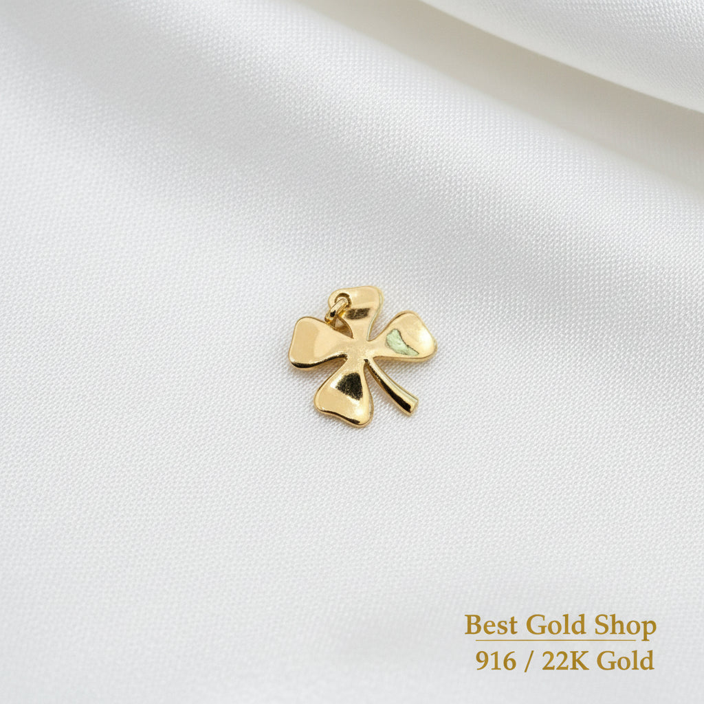 Guild Bullion 916 gold polished clover charm; collection design reference. Check selector for current options and availability.