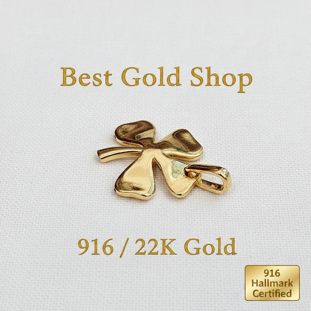 Guild Bullion 916 gold polished clover charm; collection design reference. Check selector for current options and availability.