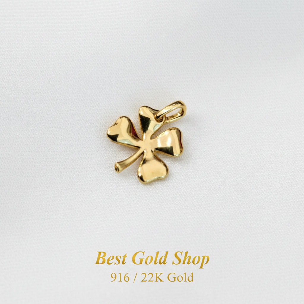 Guild Bullion 916 gold polished clover charm; collection design reference. Check selector for current options and availability.
