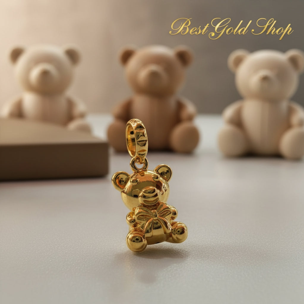 Guild Bullion 916 gold teddy bear charm; collection design reference. Check selector for current options and availability.