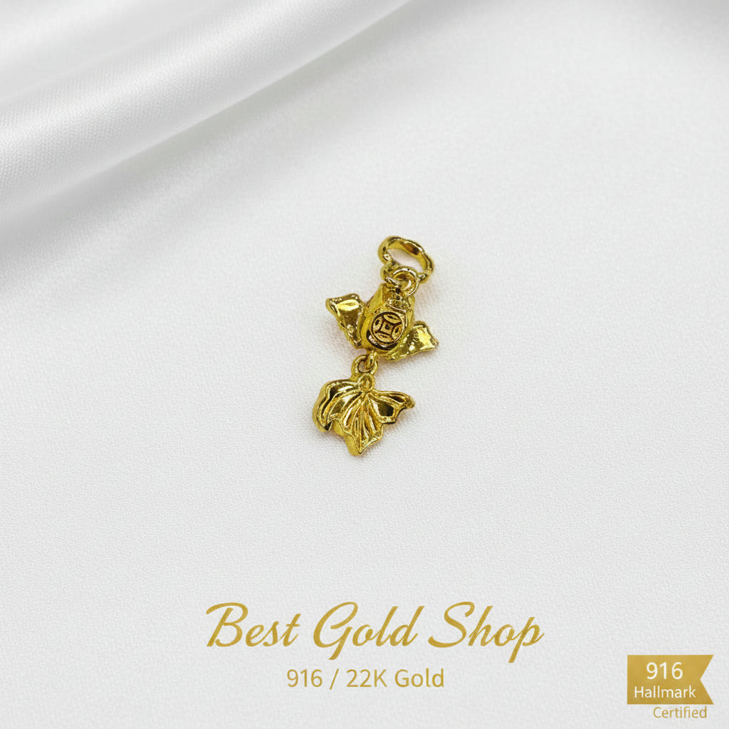 Guild Bullion 916 gold sculpted figure and leaf charm; collection design reference. Check selector for current options and availability.