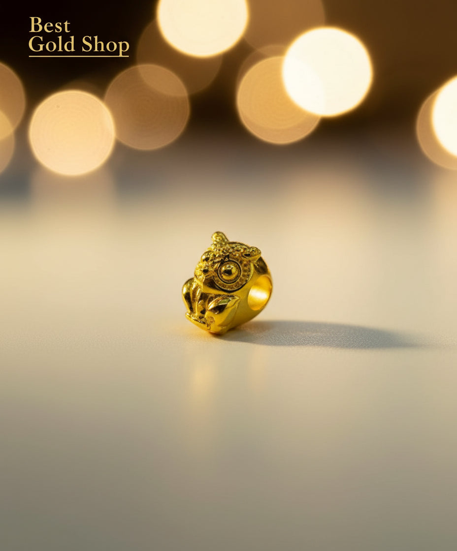 Guild Bullion 916 gold owl bead; collection design reference. Check selector for current options and availability.