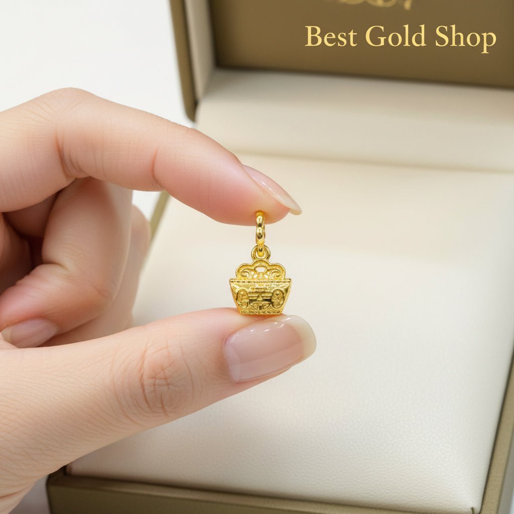 Guild Bullion 916 gold round openwork charm held in hand; collection design reference. Check selector for current options and availability.