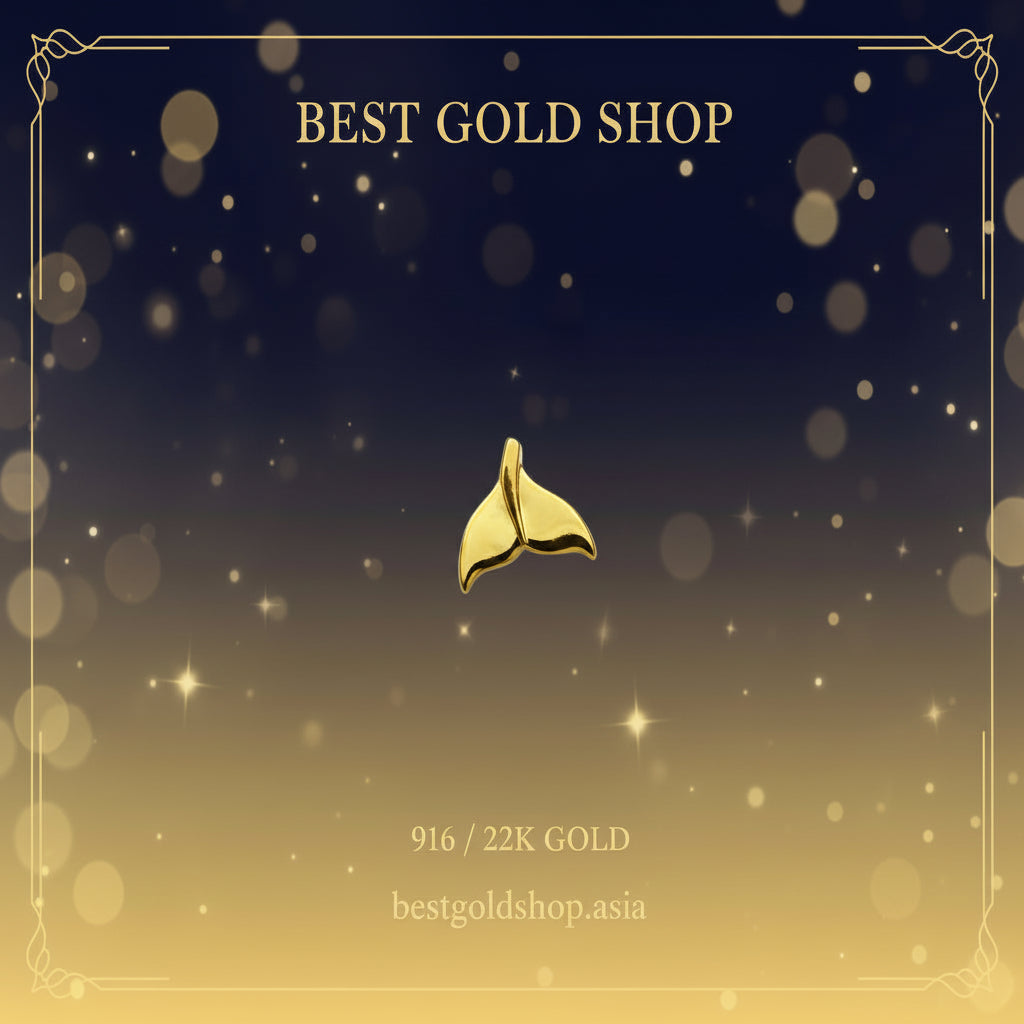 Guild Bullion 916 gold whale tail charm; collection design reference. Check selector for current options and availability.