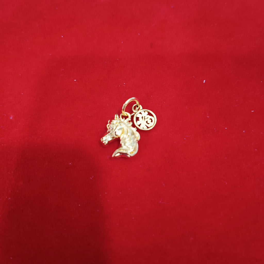 Guild Bullion 916 gold animal and coin charm on red background; collection design reference. Check selector for current options and availability.