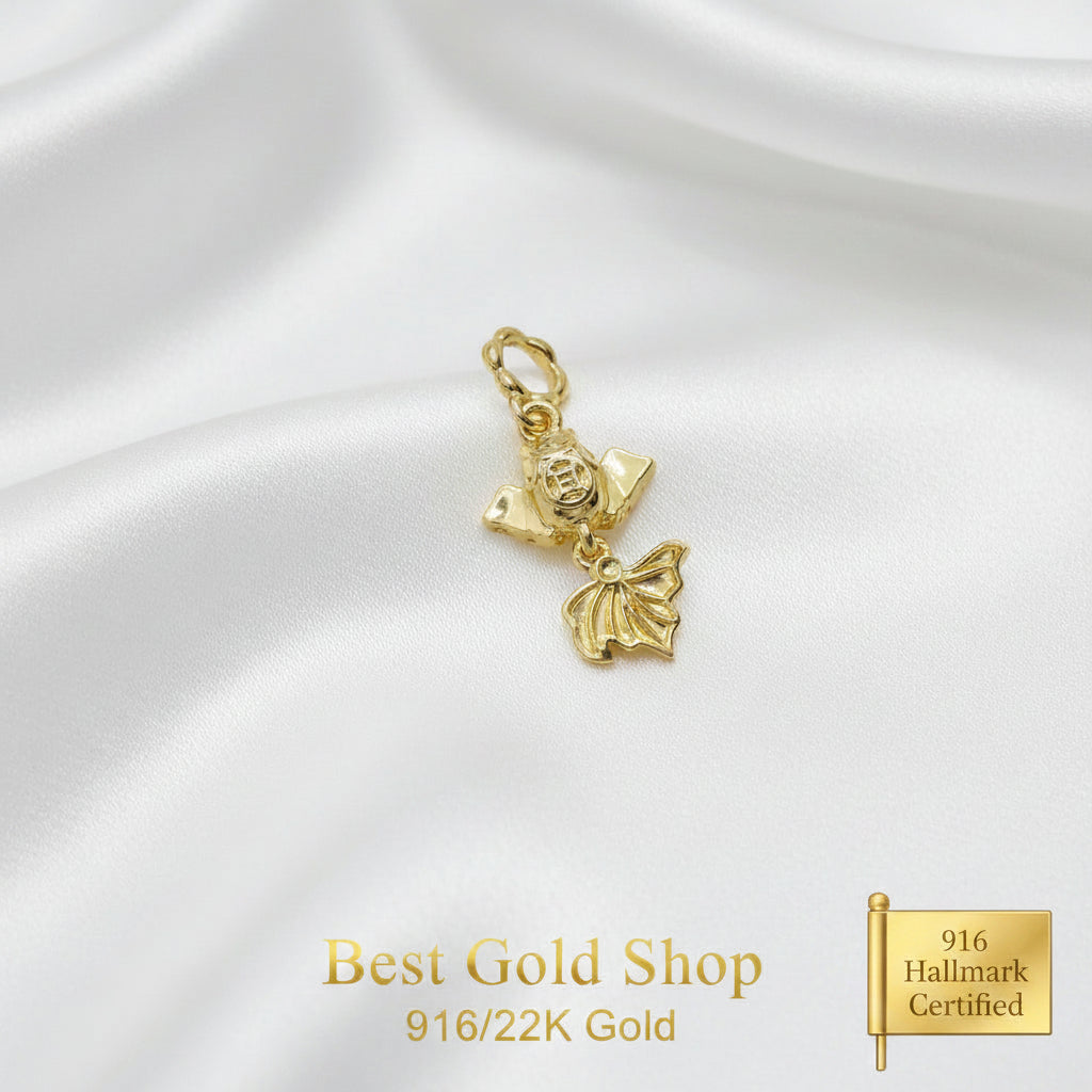 Guild Bullion 916 gold sculpted figure and leaf charm; collection design reference. Check selector for current options and availability.