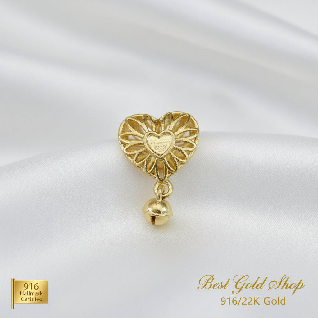 Guild Bullion 916 gold openwork heart and bell charm; collection design reference. Check selector for current options and availability.