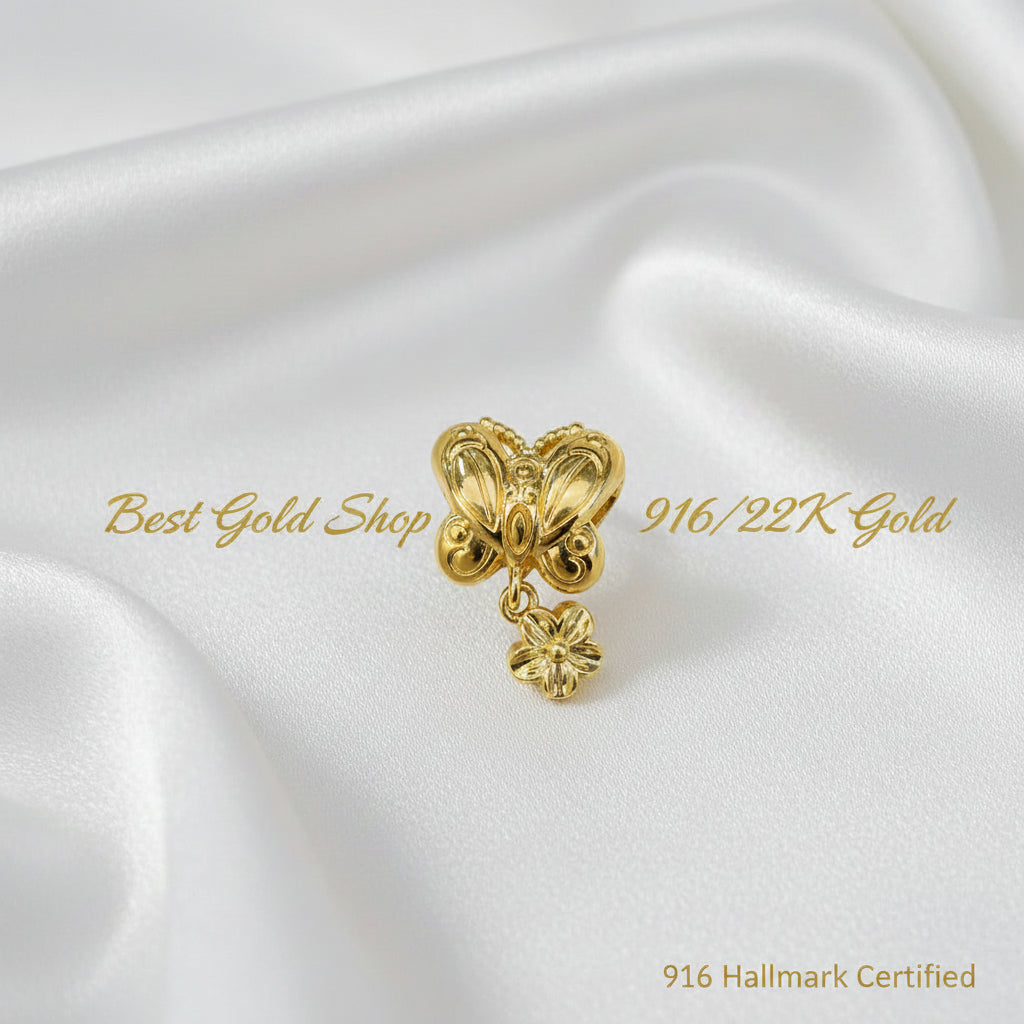 Guild Bullion 916 gold ornate heart with flower dangle; collection design reference. Check selector for current options and availability.