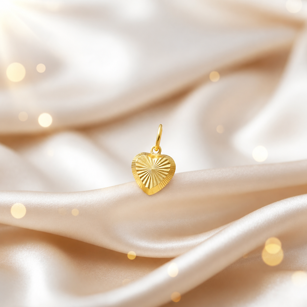 Reference view of a radiating-cut 916 gold heart pendant on cream satin