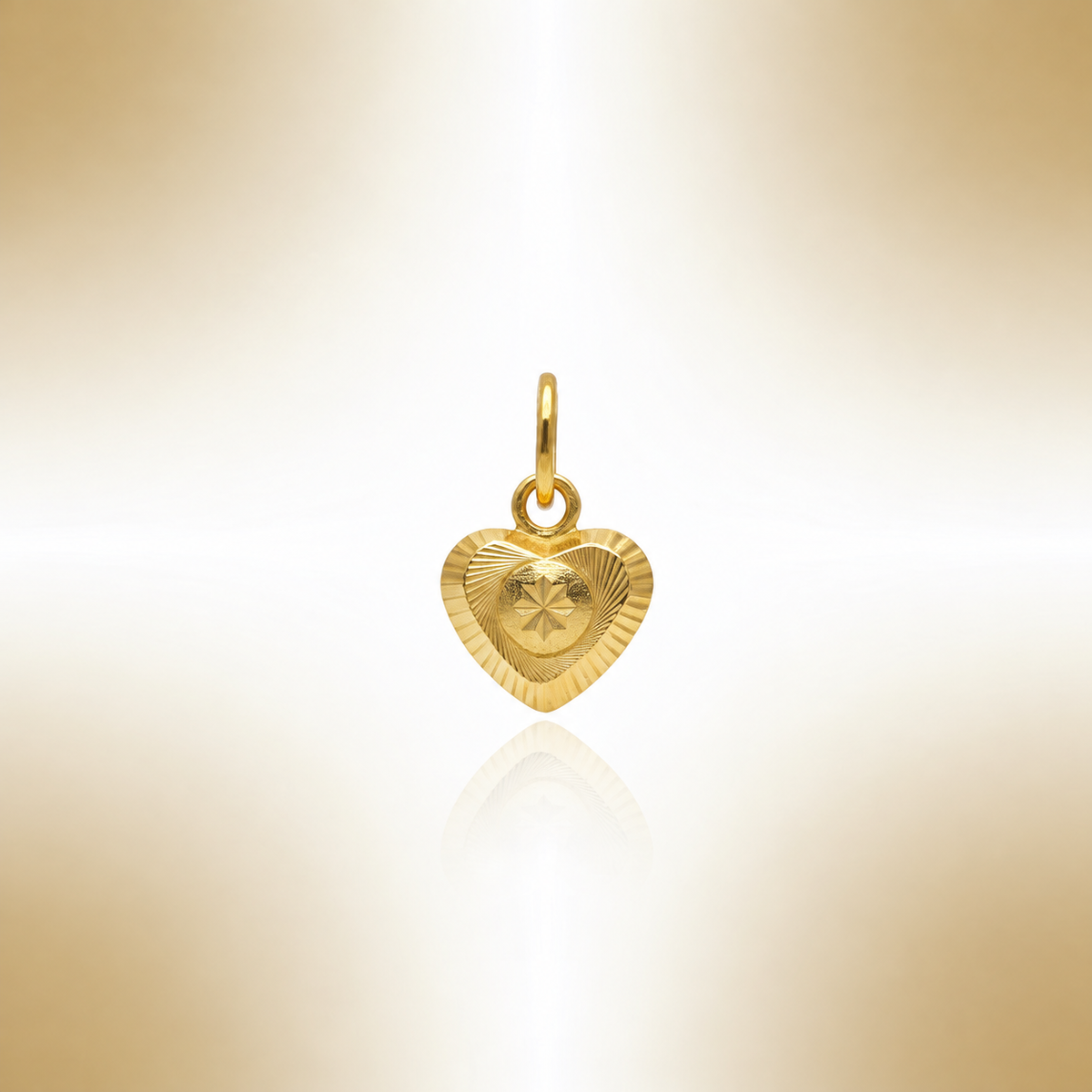 Reference view of a gold heart pendant with circular patterned centre and reflection