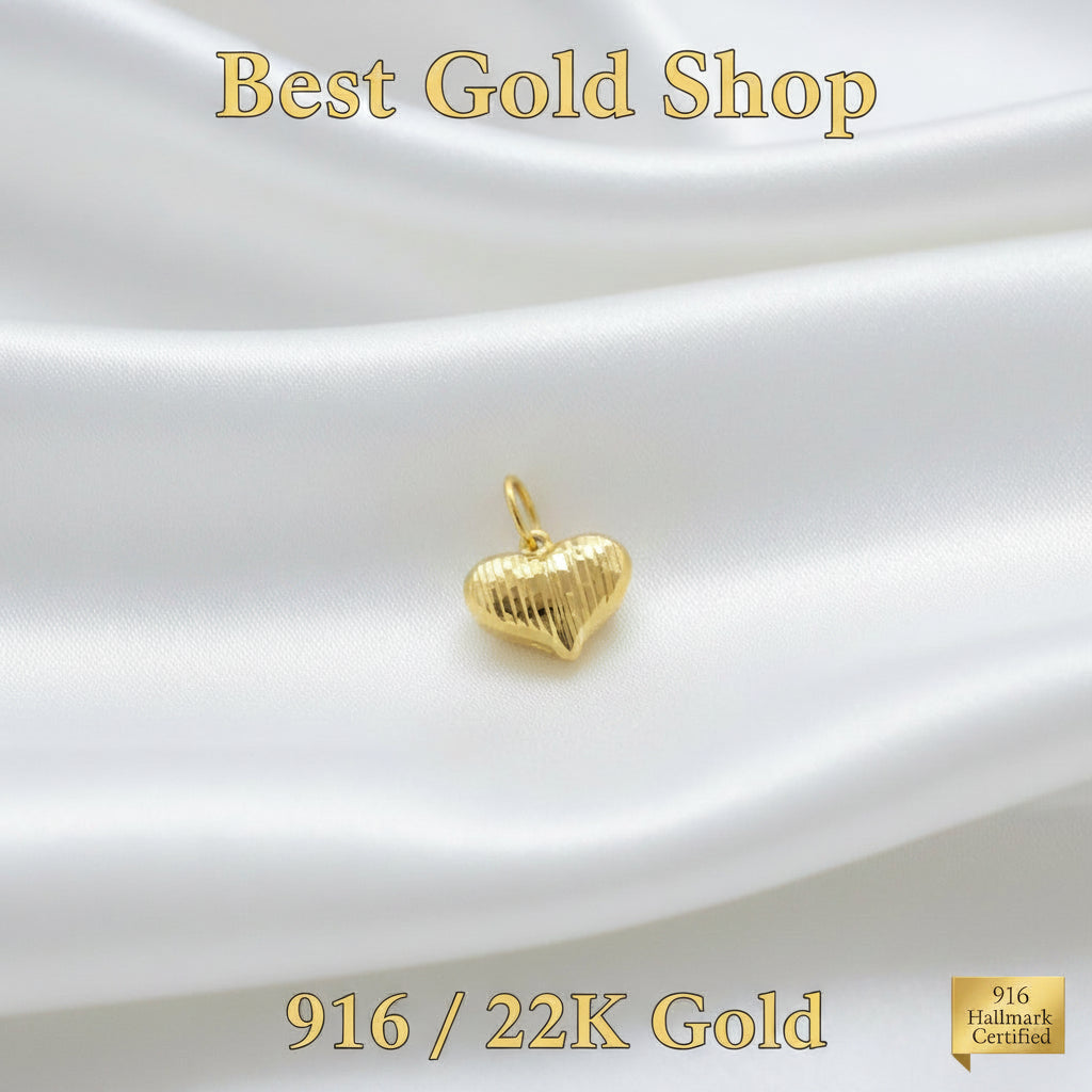916 gold Heart Cot pendant PD23868 with vertical grooves and an oval bail on white satin