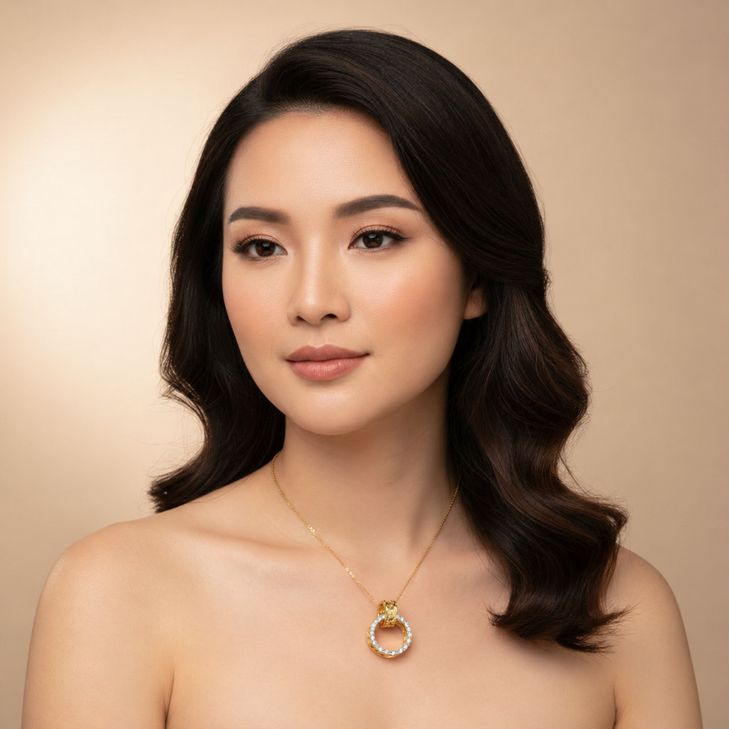 Model wearing a two-tone 916 gold ring-form pendant on a fine gold chain