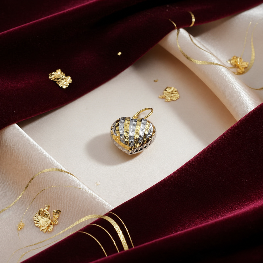 Two-tone 916 large faceted heart pendant styled on cream and burgundy fabric