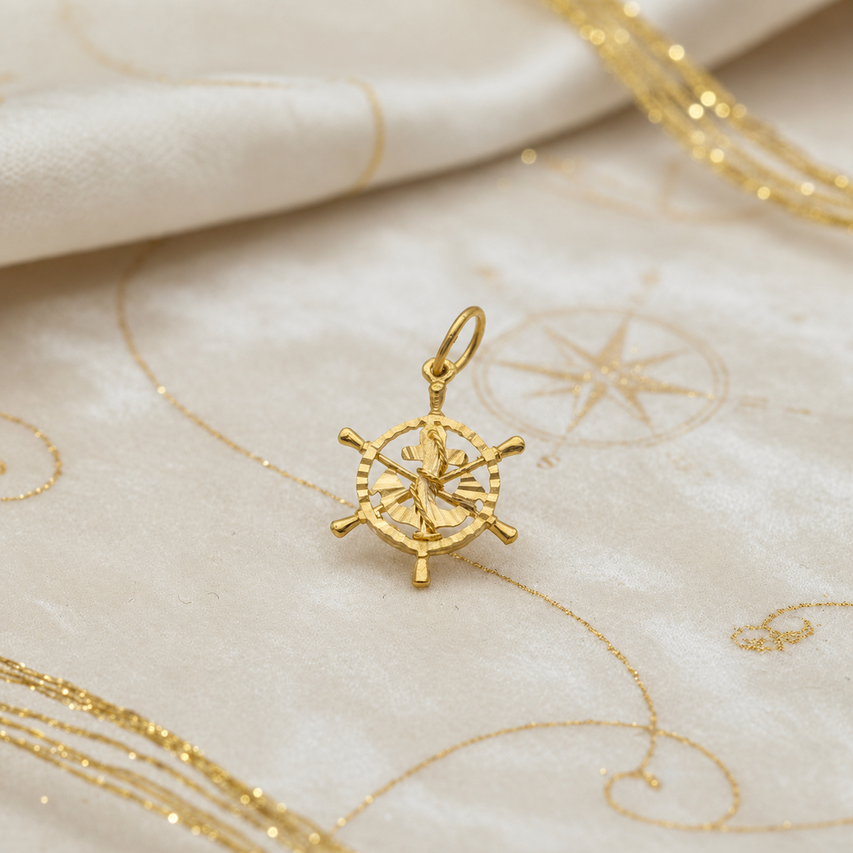 Front view of the 916 gold anchor within an openwork ship’s wheel