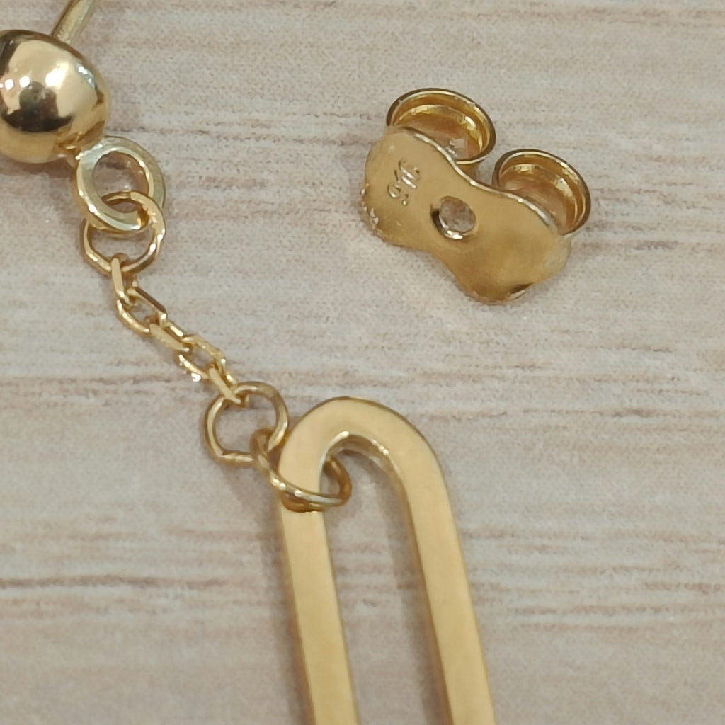 Close-up of the butterfly back, connecting chain and open link on 916 gold paperclip dangle earrings ER30015