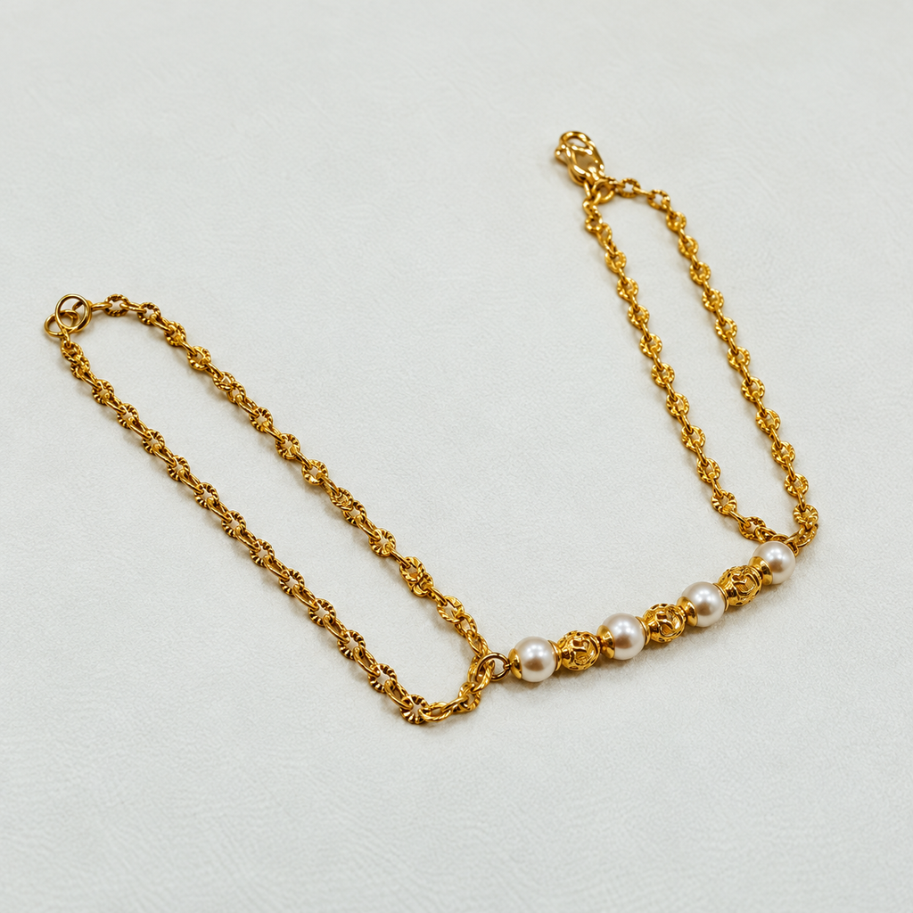 Guild Bullion 916 gold pearl-style bead bracelet full view with double chain and clasp on pale fabric