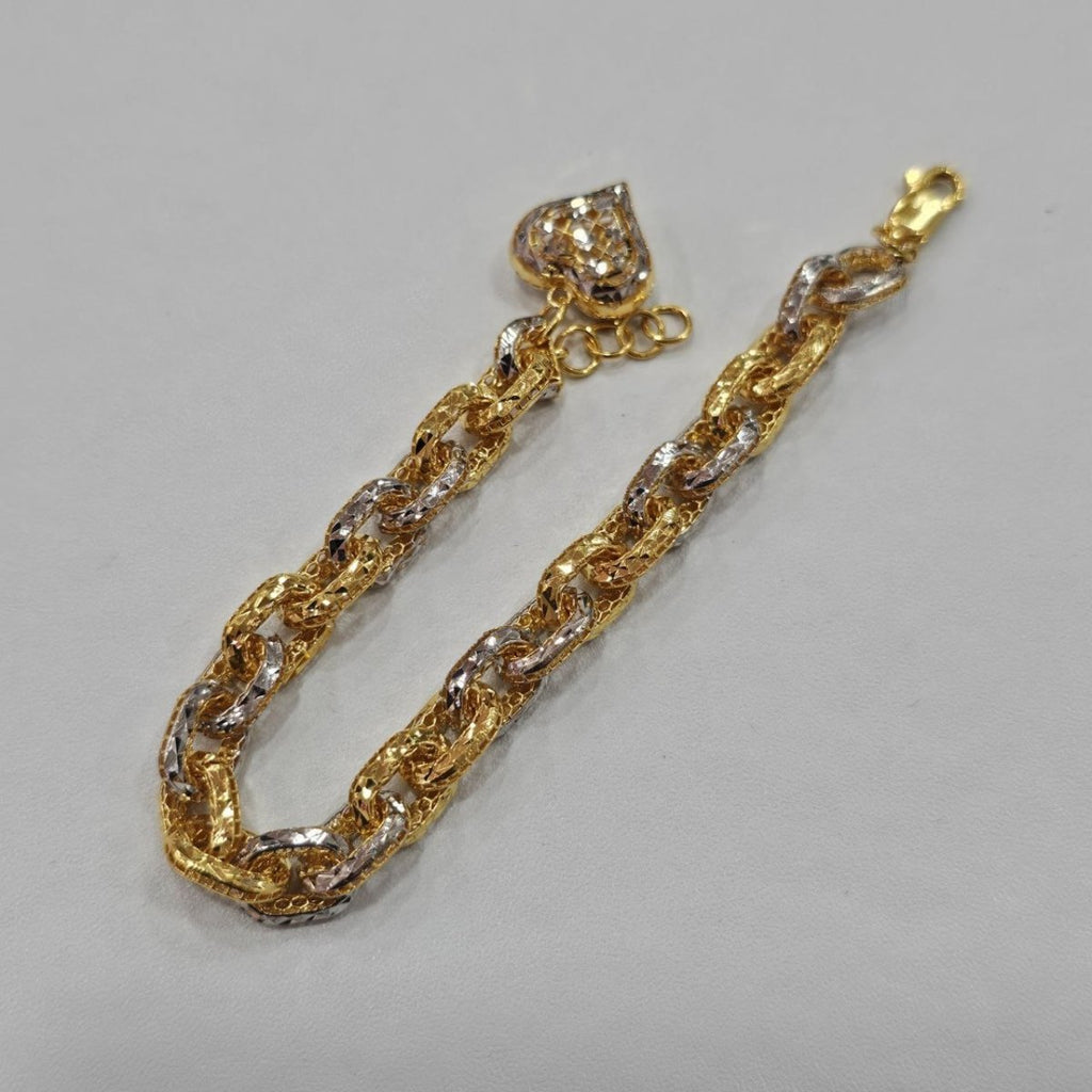 Original front view of the 916 gold Regal Link Bracelet in a U shape with two-tone links and heart charm