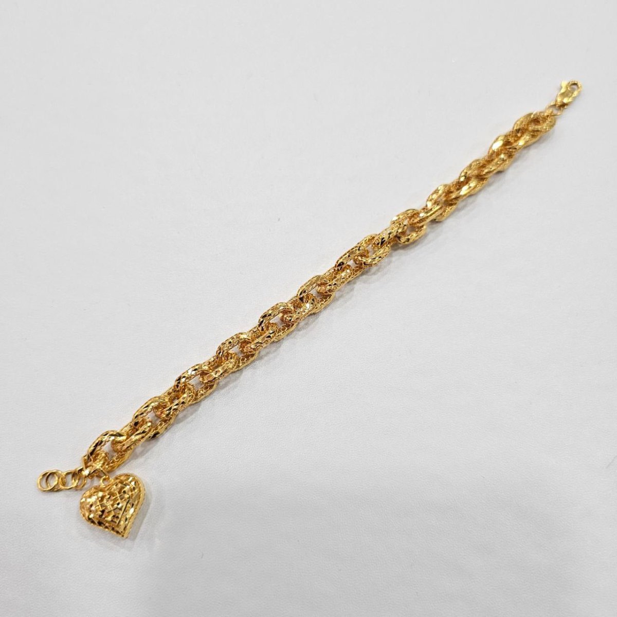 Original full reverse view of the 916 gold Regal Link Heart Charm Bracelet extended diagonally