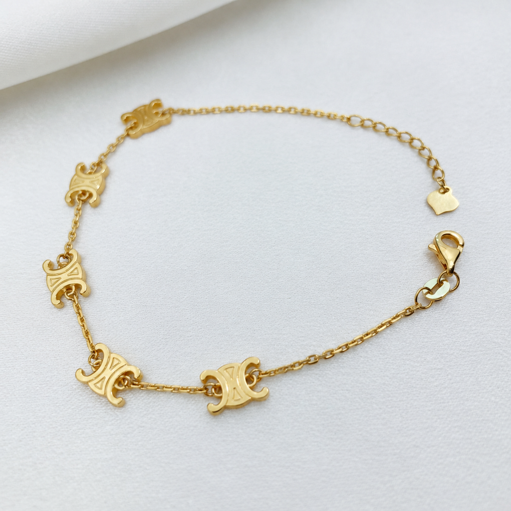 Full 916 gold Scroll Link Bracelet with five engraved scroll motifs and open lobster clasp on satin