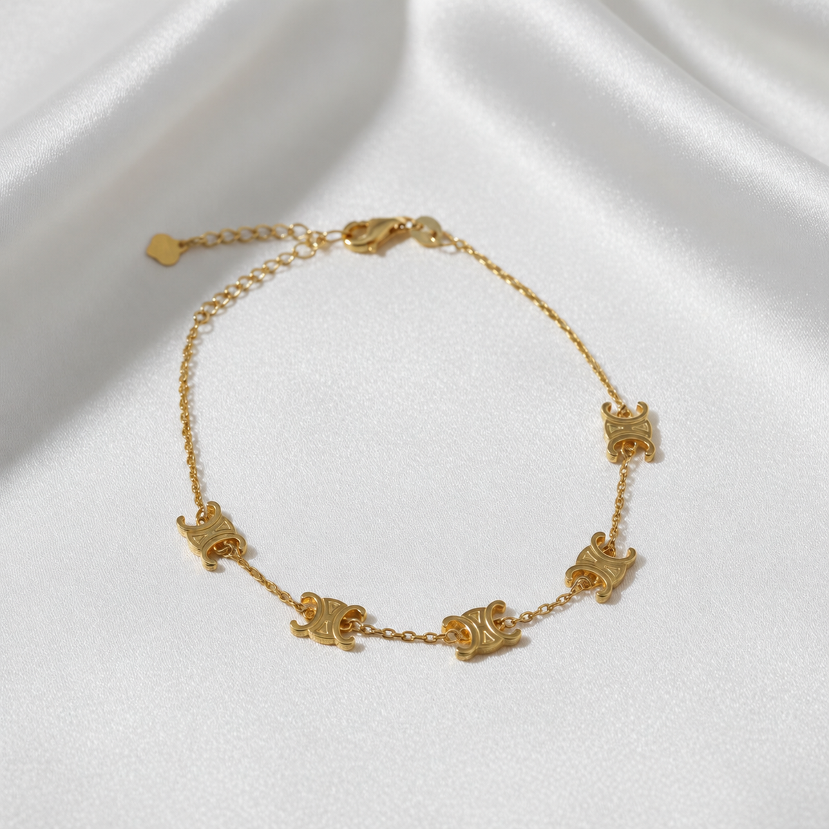 916 gold adjustable Scroll Link Bracelet with five engraved links, lobster clasp and extension chain on satin