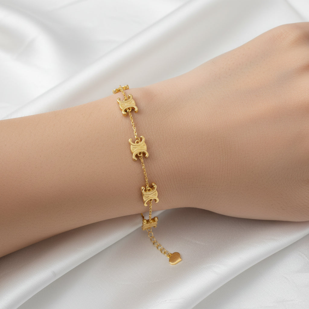 916 gold adjustable Scroll Link Bracelet worn on a wrist, showing engraved links and the extension chain