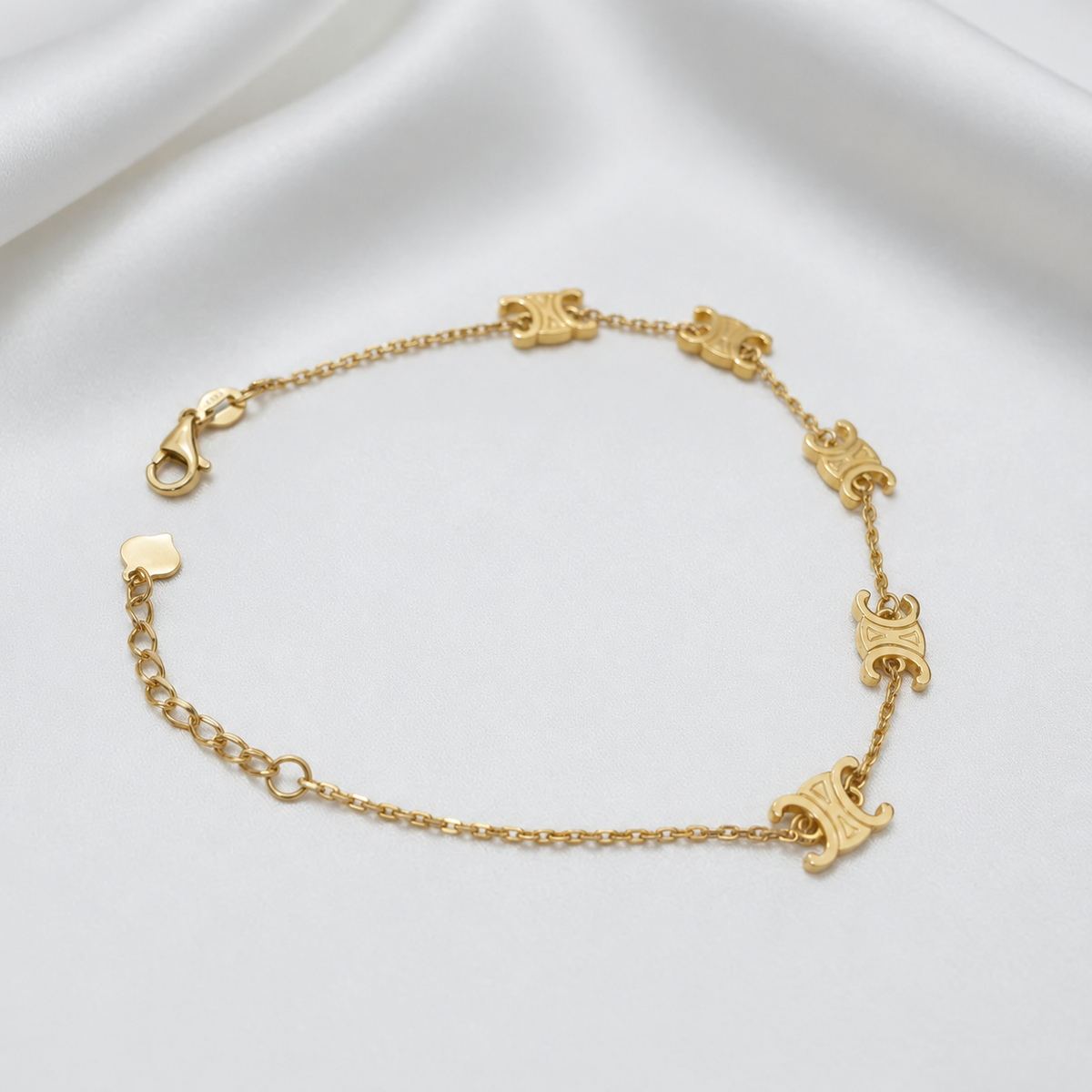 Open view of the 22K gold Scroll Link Bracelet showing its clasp and adjustable extension chain