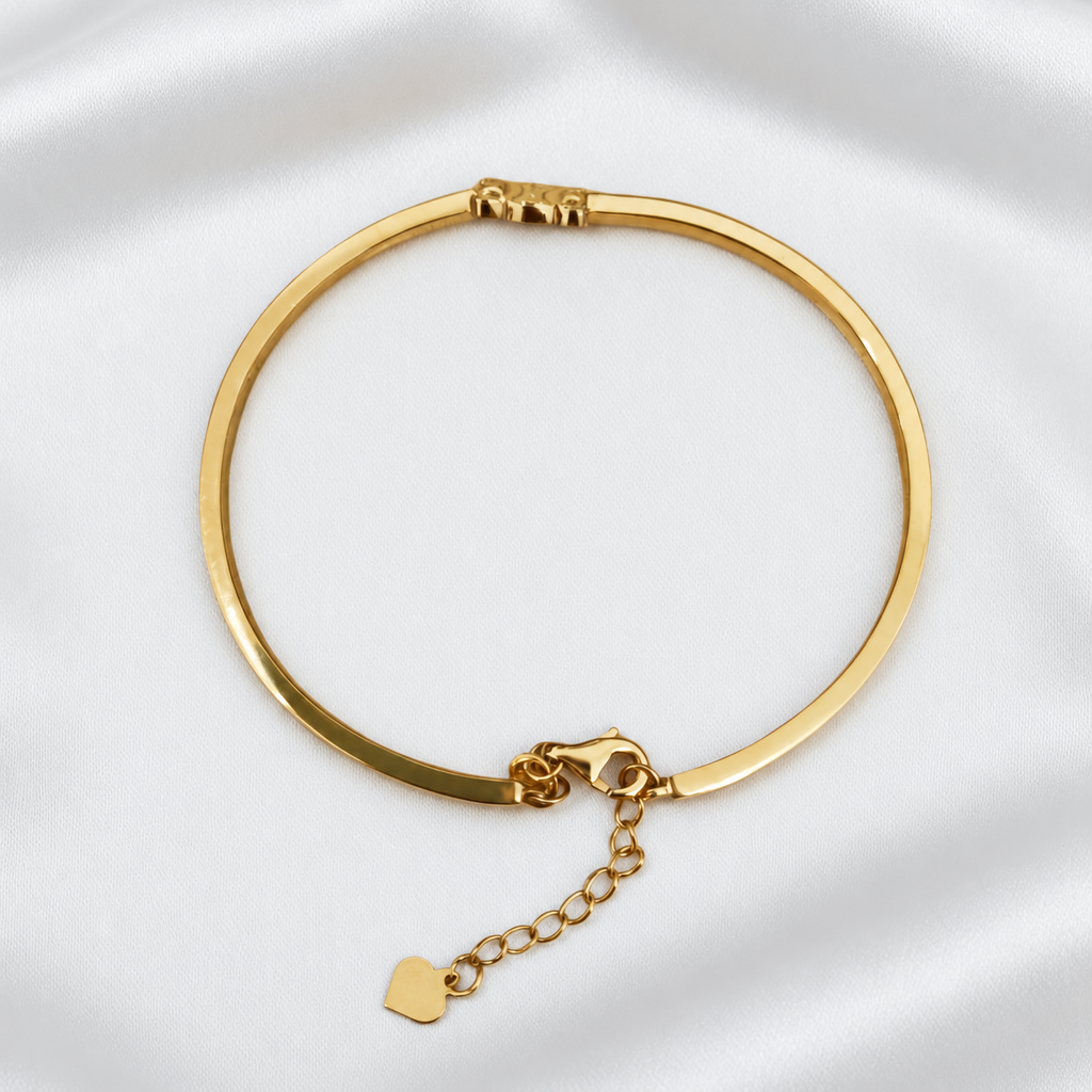 Reverse view of the 916 gold Scroll Motif Bangle with lobster clasp, extension chain and end tag