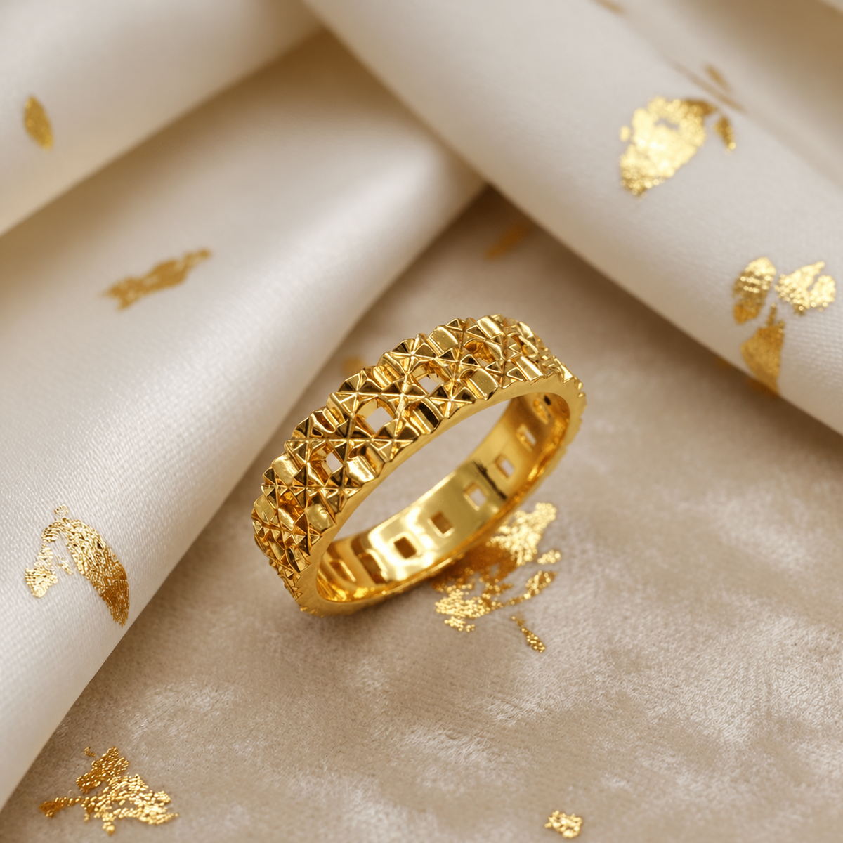Angled close-up of the 916 gold Slim Keeper ring with geometric facets and square openings
