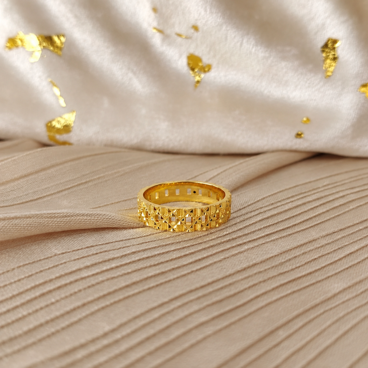 916 gold Slim Keeper ring on wood showing the geometric openwork band and polished inner surface