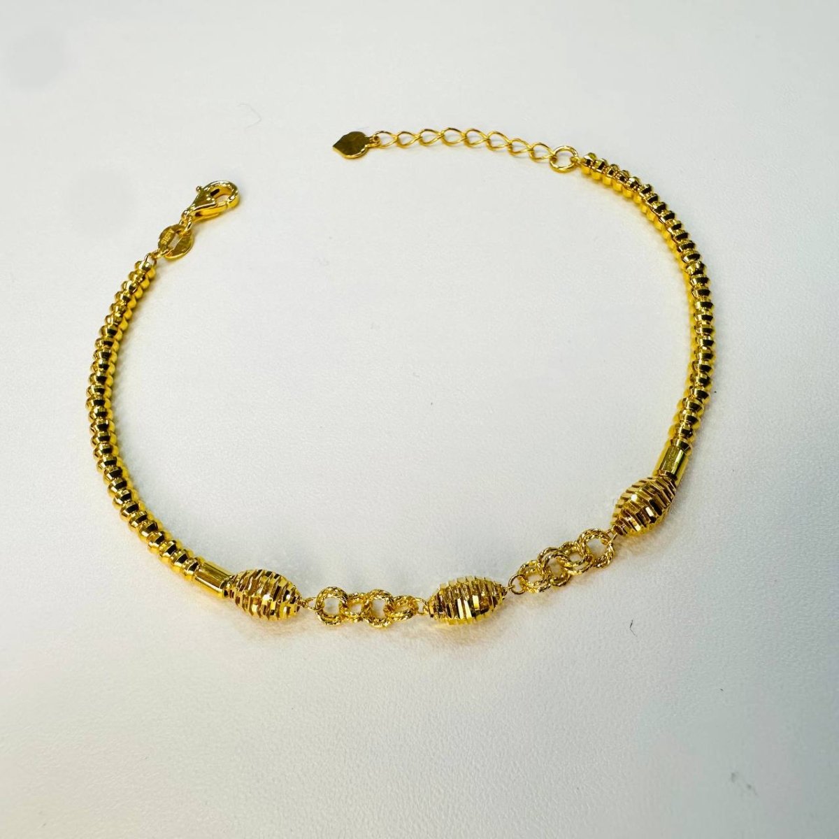 Guild Bullion 22K / 916 gold triple oval bracelet full circular view with adjustable extension and lobster clasp