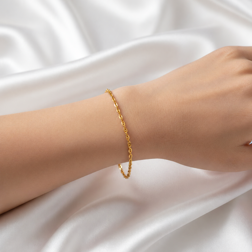 Guild Bullion 22K gold Twisted Link Bracelet worn on a wrist, showing its slim chain profile