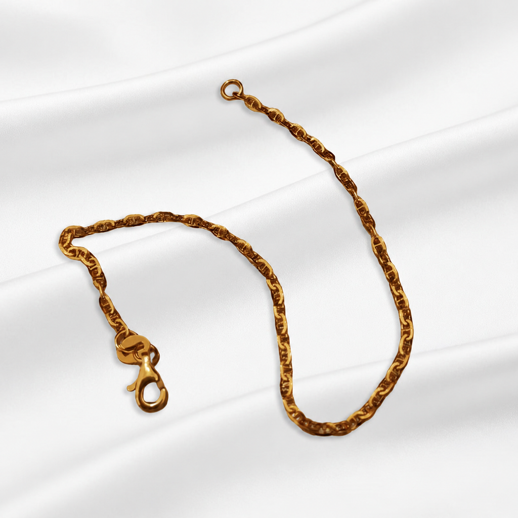 Full view of the Guild Bullion 916 gold Twisted Link Bracelet with lobster clasp and end ring on white satin