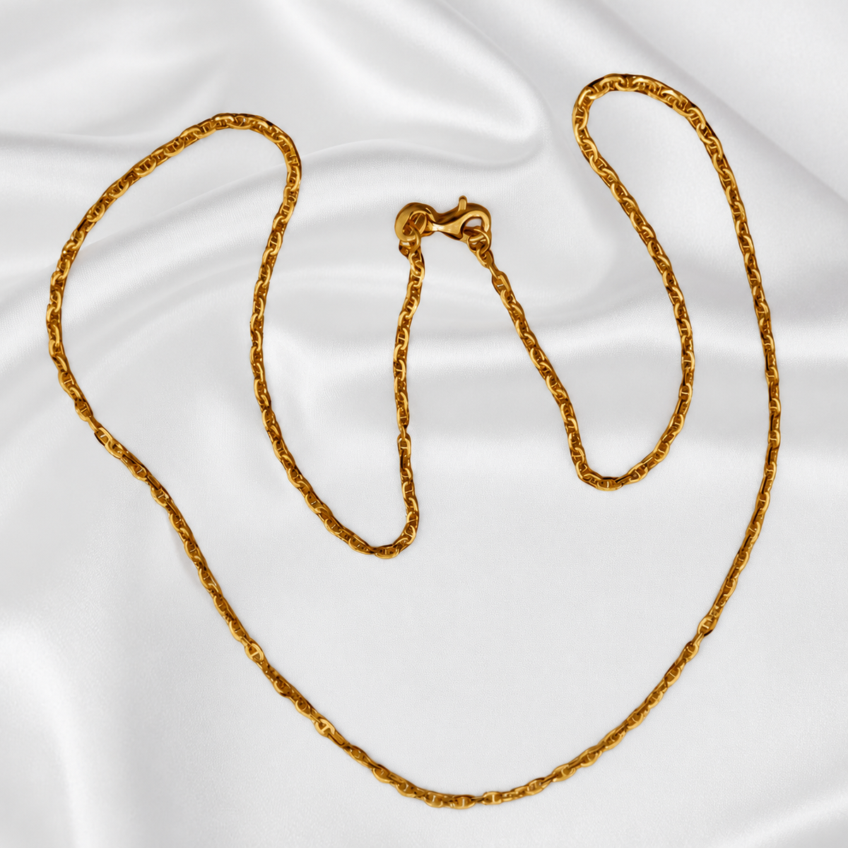 Guild Bullion 916 gold twisted link necklace overview showing polished links and hook clasp on white satin