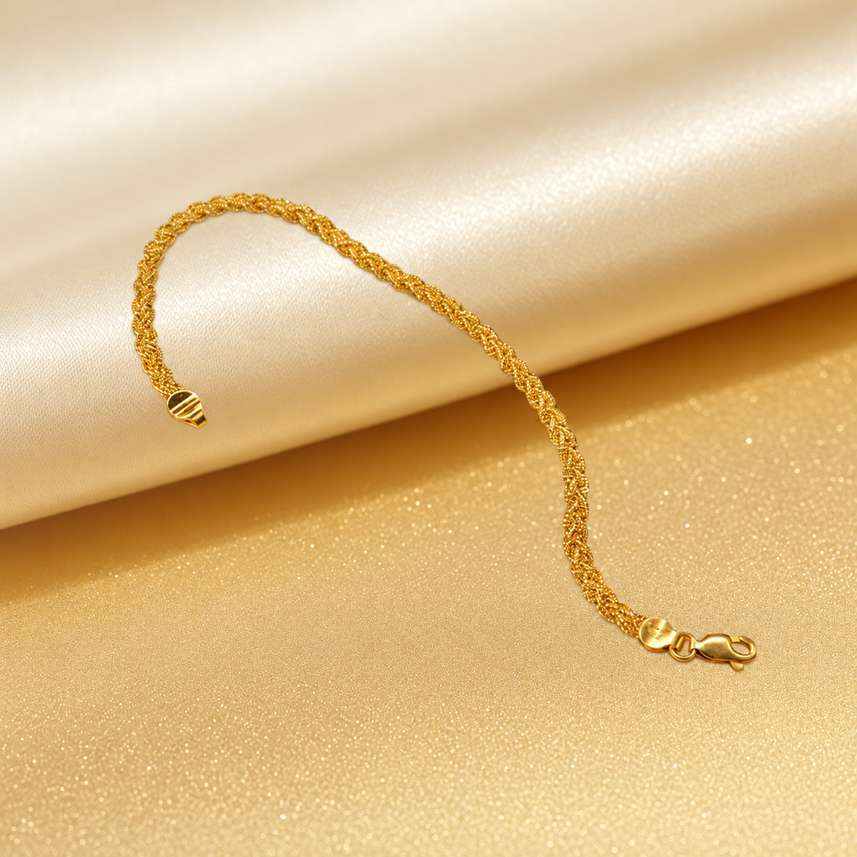 916 gold Wave Braided Bracelet slender braided profile draped over cream satin