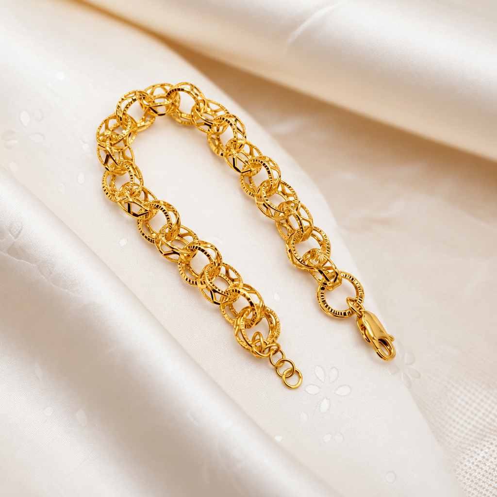 916 gold Wave WW Design Bracelet in a U shape on embroidered cream satin with clasp visible