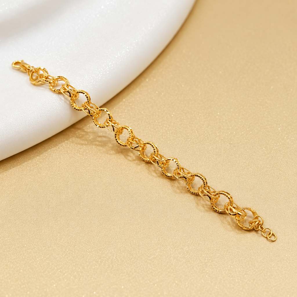 916 gold Wave WW Design Bracelet extended diagonally over a white display and warm gold background