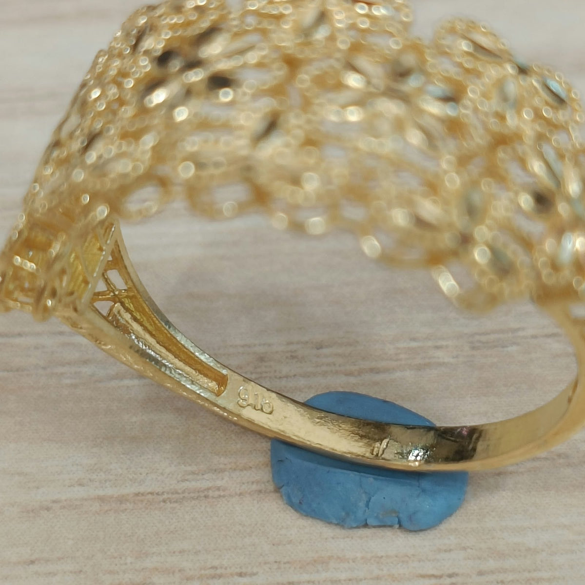 Guild Bullion 916 yellow gold Serenity Petal ring inside shank close-up showing physical 916 hallmark