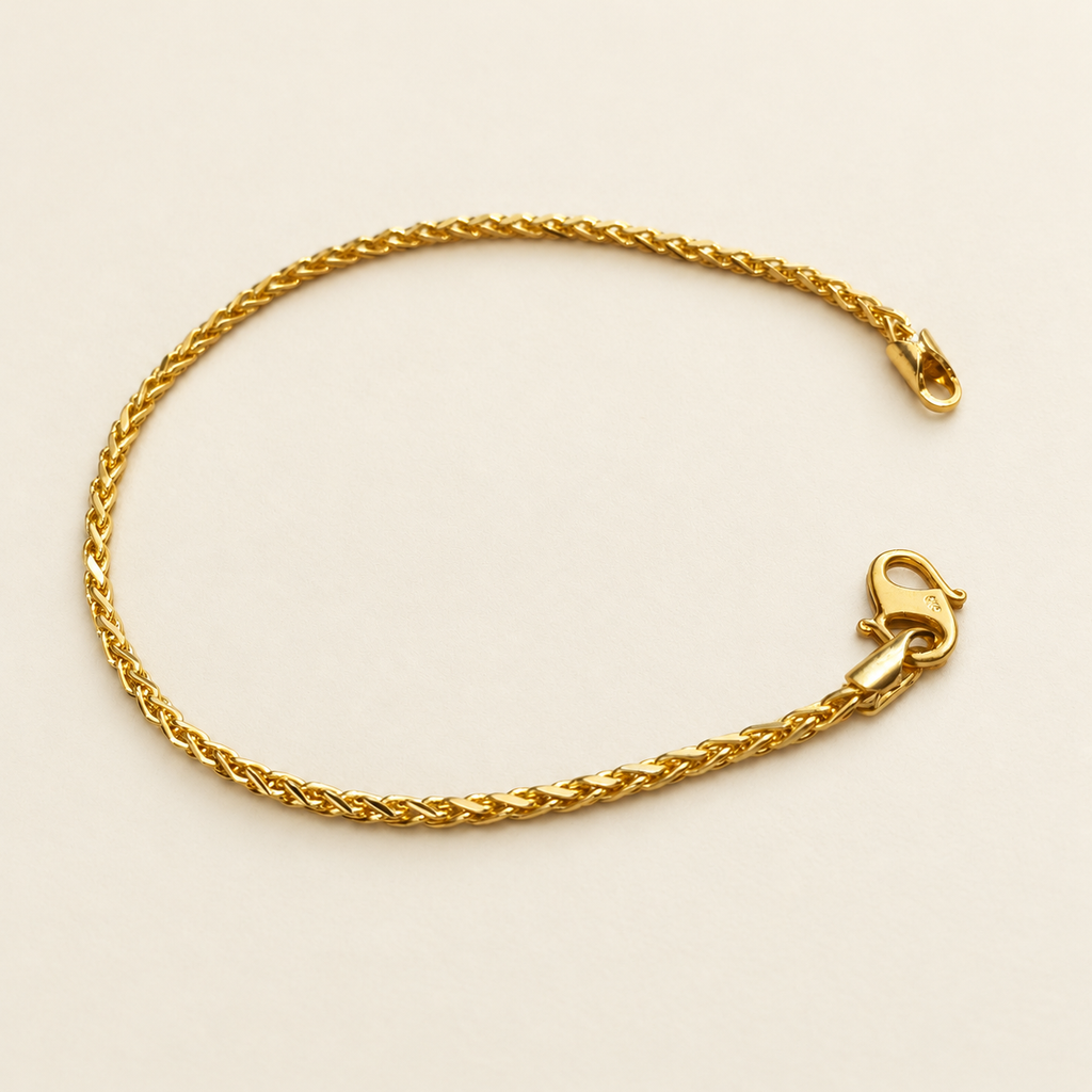 22K / 916 gold Spike Bracelet, full view showing polished diagonal links and lobster clasp on ivory