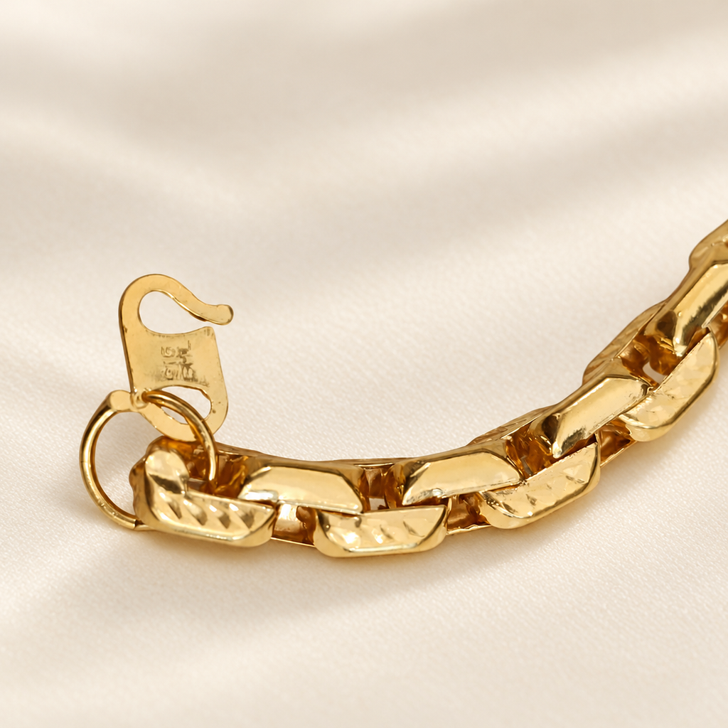Close-up of hook clasp and textured links on 22K / 916 gold bracelet